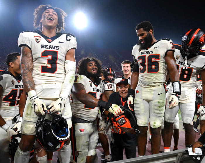 Oregon State Beavers celebrate with fans after defeating the USC Trojans.